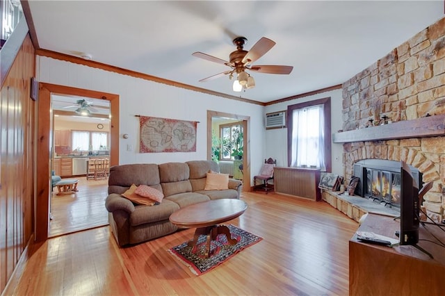 447 Greeley Ave, Staten Island, NY 10306 - living room with ceiling fan, ornamental molding, light wood-style flooring, plenty of natural light, and a wall unit AC