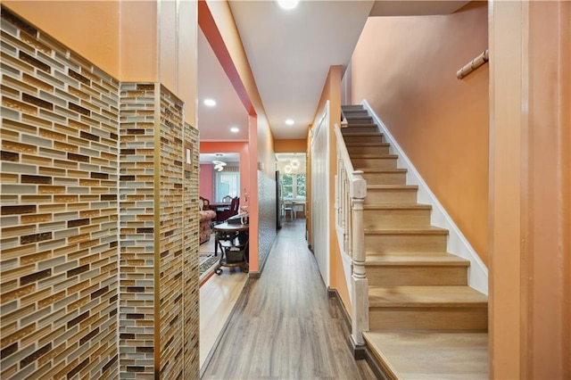 4640 Bedford Ave, Brooklyn, NY 11235 - staircase with wood finished floors, baseboards, and recessed lighting
