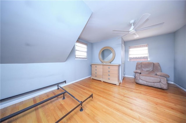 bedroom with baseboards, ceiling fan, and wood finished floors