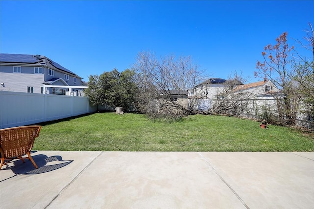 view of yard with a fenced backyard and a patio area
