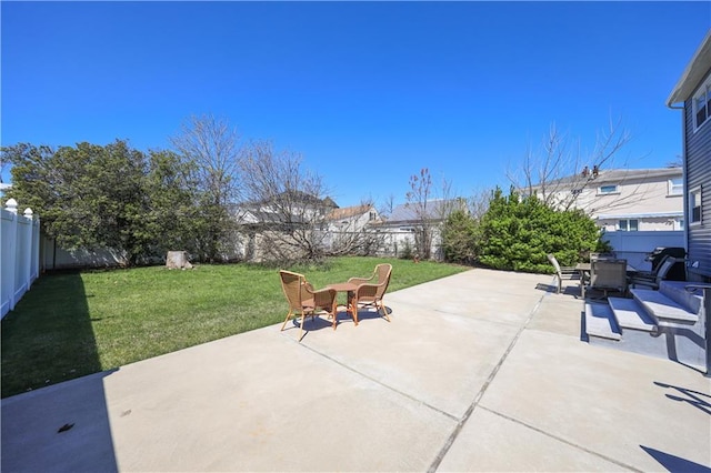 view of patio featuring a fenced backyard and outdoor dining space