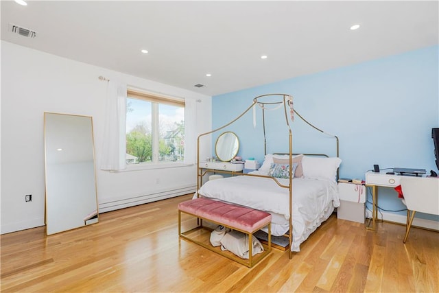 21 Sprague Ave, Staten Island, NY 10307 - bedroom featuring a baseboard radiator, wood finished floors, and recessed lighting
