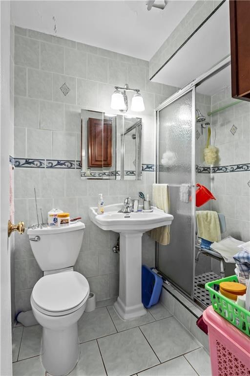 1655 Flatbush Ave Unit B204, Brooklyn, NY 11210 - full bath with tile walls, tile patterned flooring, tasteful backsplash, a stall shower, and toilet
