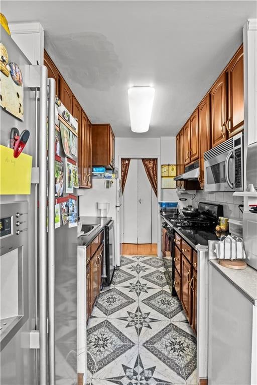1655 Flatbush Ave Unit B204, Brooklyn, NY 11210 - kitchen featuring decorative backsplash, brown cabinets, exhaust hood, and stainless steel appliances