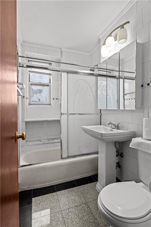 1655 Flatbush Ave Unit B204, Brooklyn, NY 11210 - full bath with ornamental molding, enclosed tub / shower combo, granite finish floor, and toilet