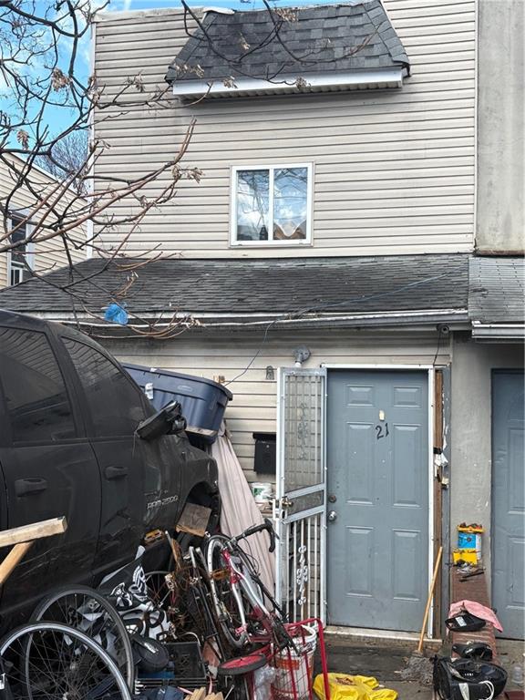 21 Preston Ct, Brooklyn, NY 11234 - doorway to property featuring a shingled roof