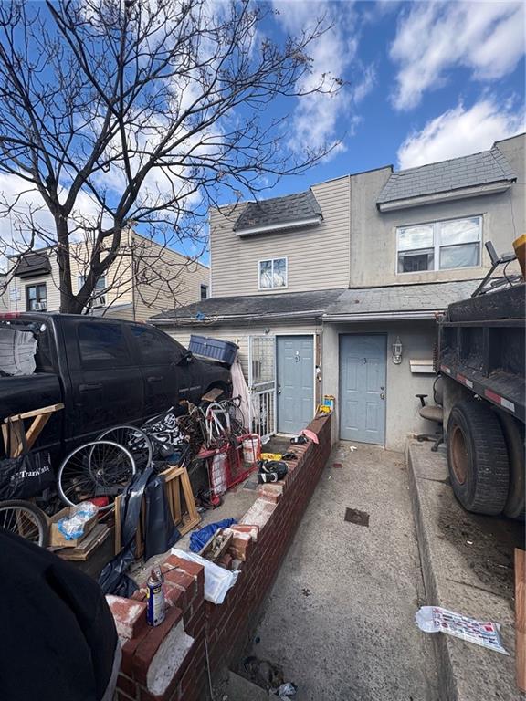 21 Preston Ct, Brooklyn, NY 11234 - view of property featuring stucco siding