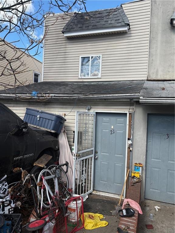 21 Preston Ct, Brooklyn, NY 11234 - entrance to property featuring a shingled roof