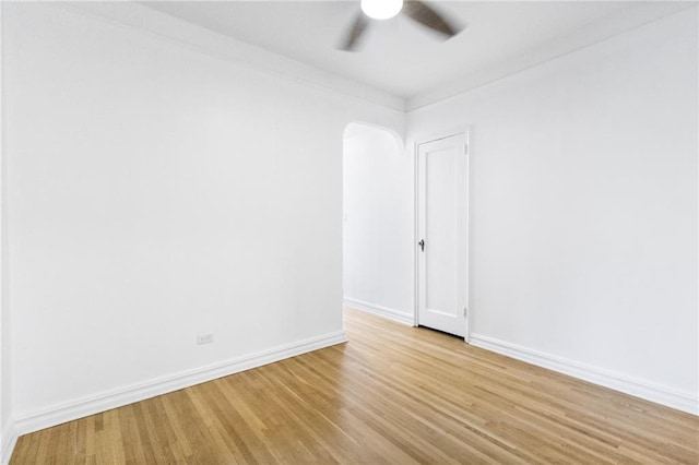 1500 Ocean Pkwy Unit 4G, Brooklyn, NY 11230 - spare room featuring ceiling fan, light wood-style flooring, baseboards, and arched walkways