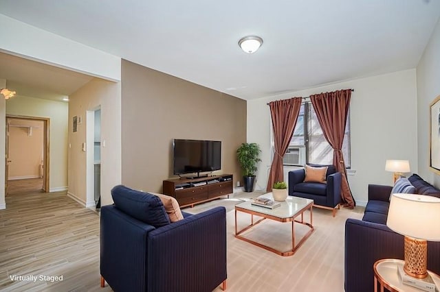 2645 Homecrest Ave Unit 4C, Brooklyn, NY 11235 - living room with light wood-type flooring, baseboards, and cooling unit