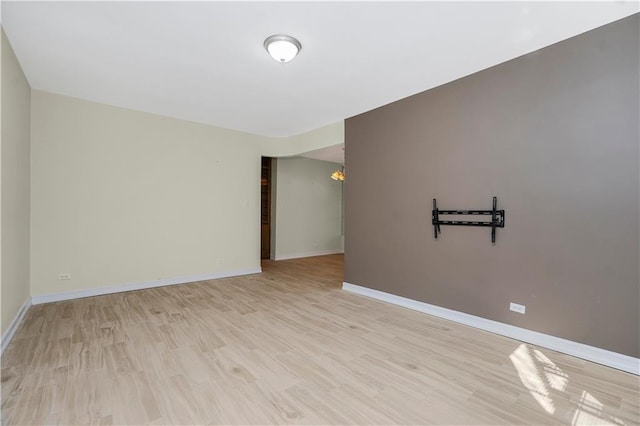 2645 Homecrest Ave Unit 4C, Brooklyn, NY 11235 - empty room featuring light wood-style floors, baseboards, and a chandelier