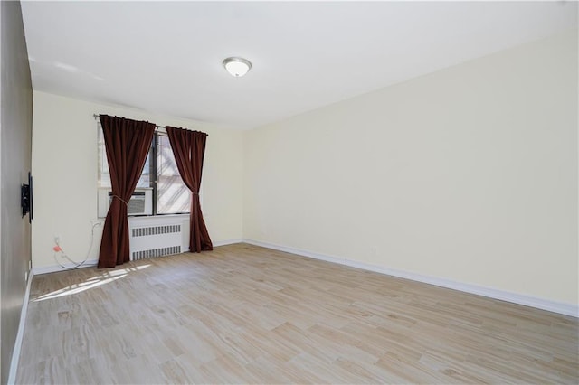 2645 Homecrest Ave Unit 4C, Brooklyn, NY 11235 - unfurnished room with radiator heating unit, light wood-style floors, baseboards, and cooling unit