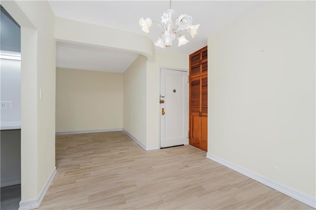 2645 Homecrest Ave Unit 4C, Brooklyn, NY 11235 - entrance foyer with a chandelier, light wood finished floors, and baseboards