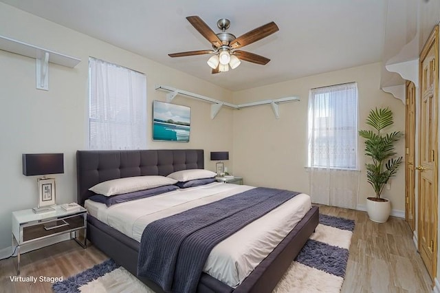 2645 Homecrest Ave Unit 4C, Brooklyn, NY 11235 - bedroom with light wood-style flooring, a ceiling fan, and baseboards