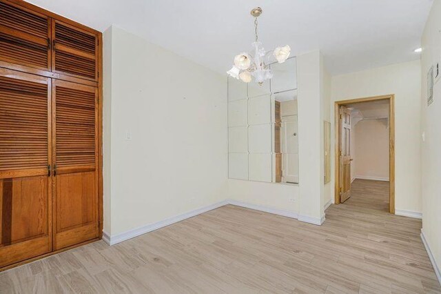 2645 Homecrest Ave Unit 4C, Brooklyn, NY 11235 - unfurnished dining area featuring a chandelier and light wood-type flooring