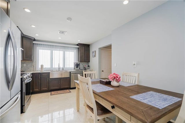 dining area with recessed lighting, light tile patterned floors, and visible vents