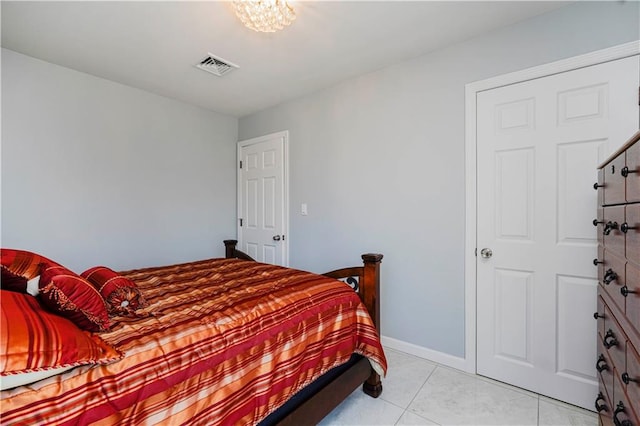 bedroom with visible vents and light tile patterned flooring