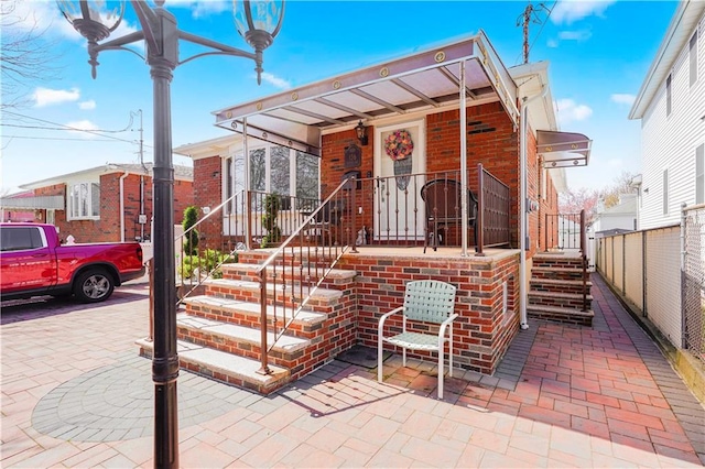 view of front of home featuring brick siding