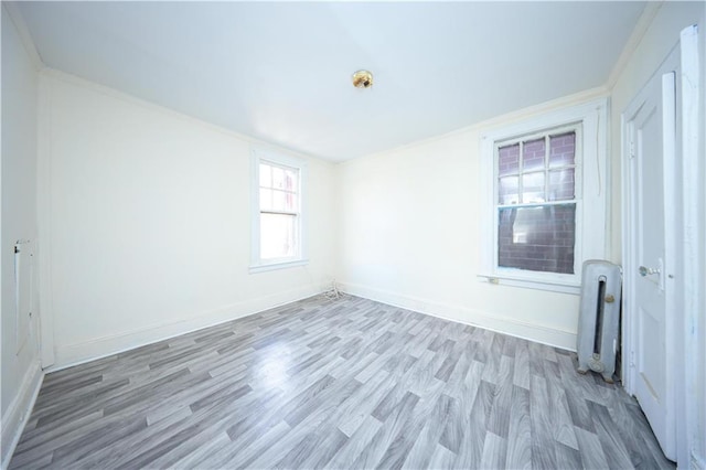 3029 Brighton 5th St Unit 3, Brooklyn, NY 11235 - empty room with wood finished floors and crown molding