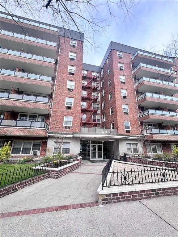 525 Ocean Pkwy Unit 4J, Brooklyn, NY 11218 - view of apartment building / complex featuring a fenced front yard and driveway