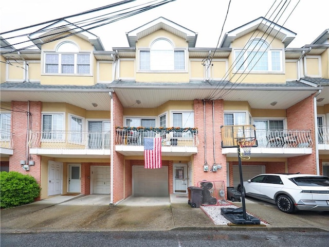 19 Ostrich Ct, Staten Island, NY 10309 - view of front of house with a garage, brick siding, driveway, and stucco siding