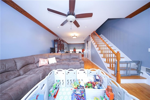 living room with recessed lighting, stairway, a ceiling fan, ornamental molding, and wood finished floors