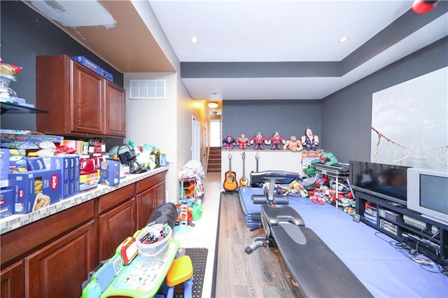 playroom featuring recessed lighting, visible vents, and wood finished floors