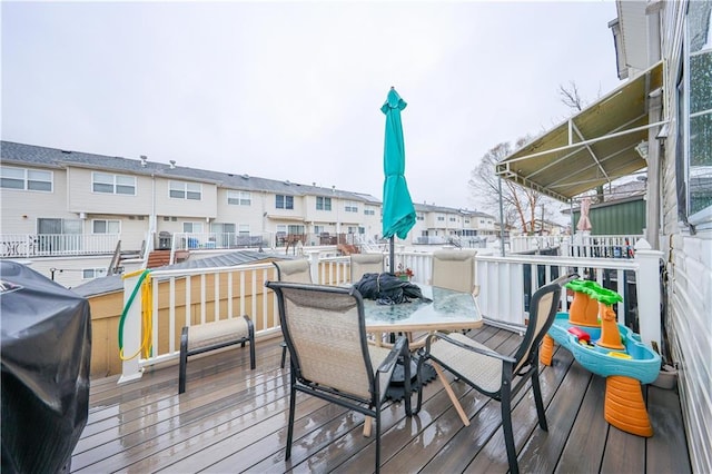deck featuring grilling area and a residential view