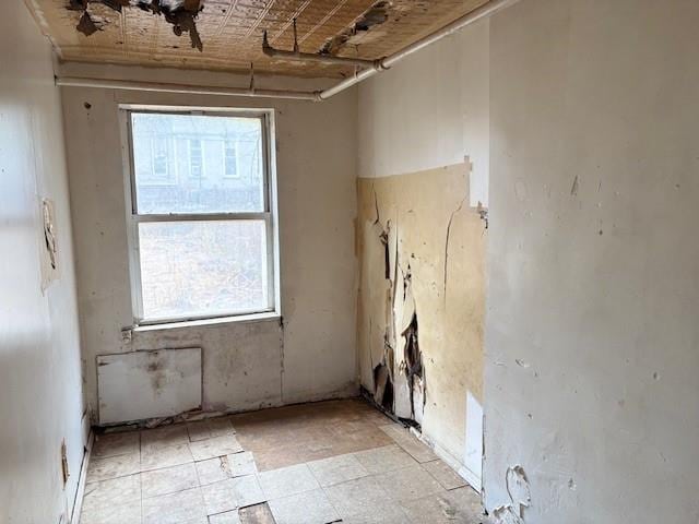 unfurnished room with light floors