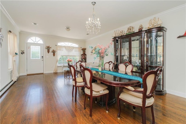 dining room featuring ornamental molding, visible vents, an inviting chandelier, and wood finished floors