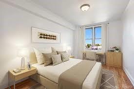 bedroom with wood finished floors and baseboards