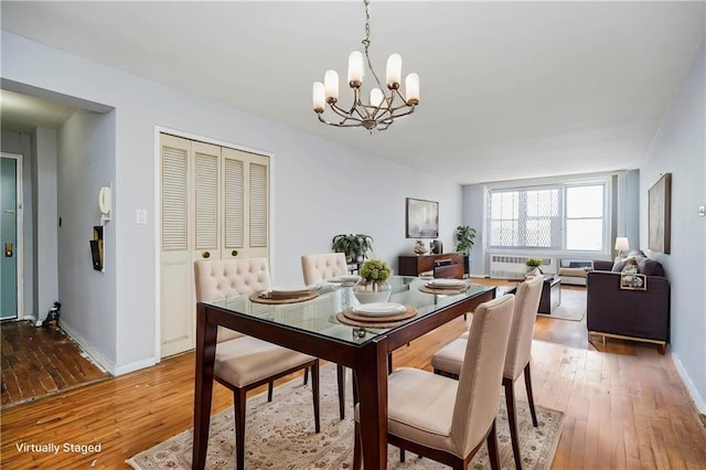 1580 E 13th St Unit 5C, Brooklyn, NY 11230 - dining area featuring light wood-type flooring, a chandelier, baseboards, and radiator