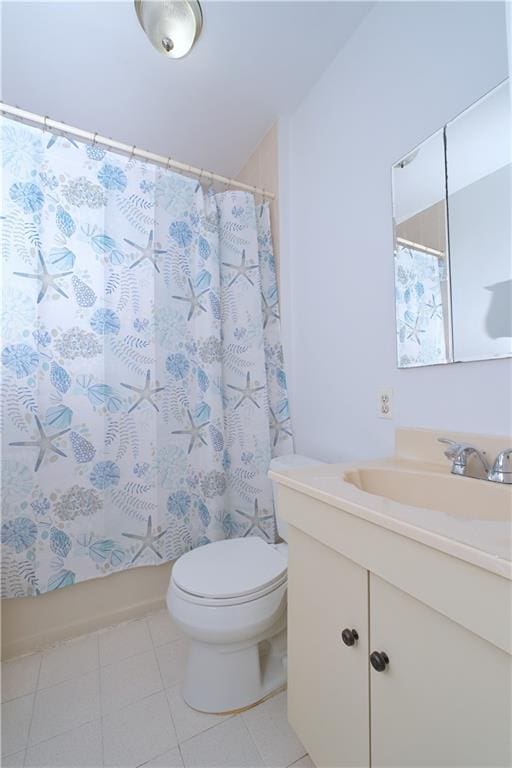 bathroom with toilet, vanity, tile patterned floors, and shower / bath combination with curtain