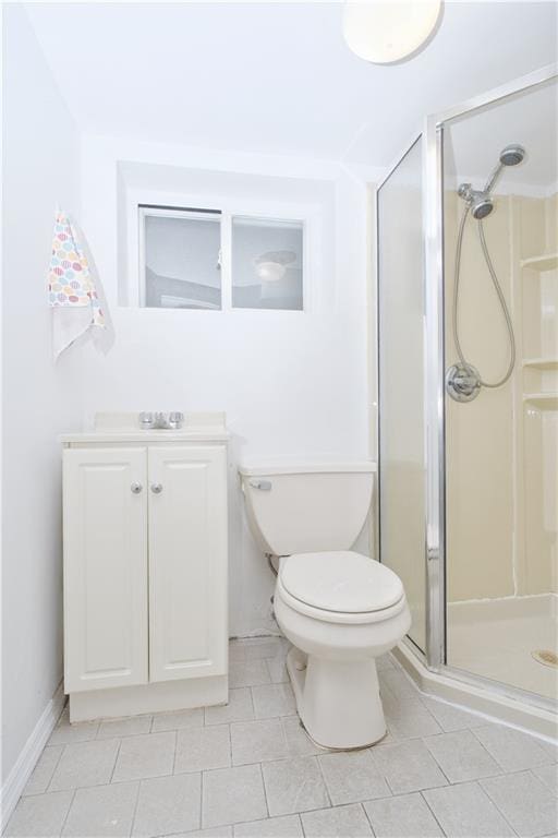 full bathroom featuring a shower stall, toilet, tile patterned flooring, and vanity