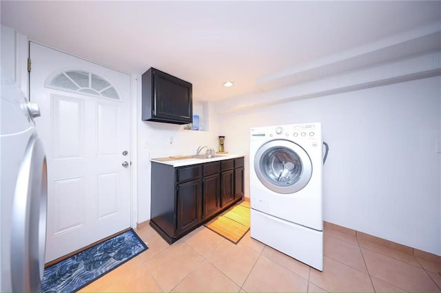2961 Voorhies Ave, Brooklyn, NY 11235 - laundry area with cabinet space, light tile patterned flooring, washer / dryer, and recessed lighting