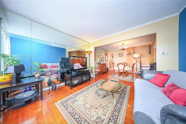 2961 Voorhies Ave, Brooklyn, NY 11235 - living area with wood finished floors, ornamental molding, and a chandelier