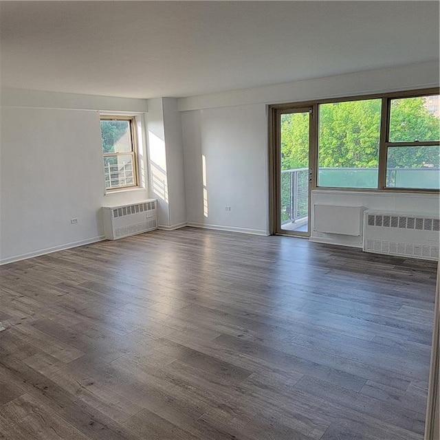 1065 Vermont St Unit 6D, Brooklyn, NY 11207 - empty room featuring radiator, dark wood-style flooring, and baseboards