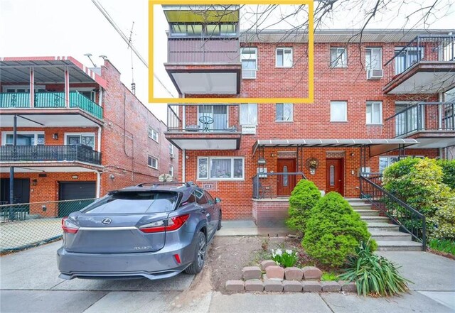 2235A 84th St Unit 1C, Brooklyn, NY 11214 - view of front of house with brick siding and cooling unit