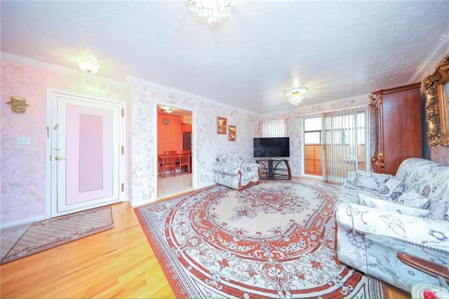 2235A 84th St Unit 1C, Brooklyn, NY 11214 - living area with wood finished floors, crown molding, a textured ceiling, and wallpapered walls