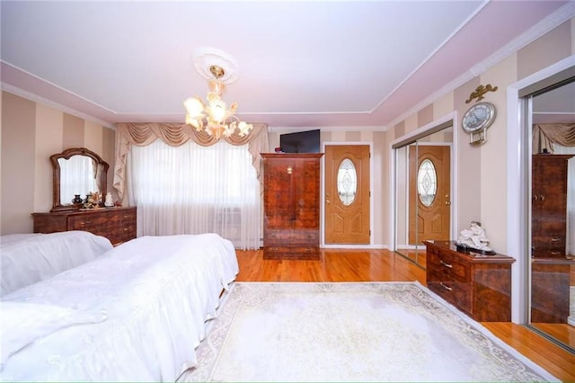 2235A 84th St Unit 1C, Brooklyn, NY 11214 - bedroom with crown molding, a chandelier, wood finished floors, and a closet