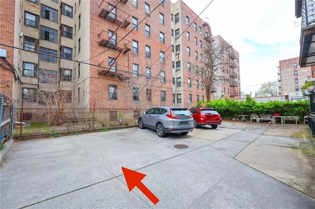 2235A 84th St Unit 1C, Brooklyn, NY 11214 - view of apartment building / complex featuring uncovered parking
