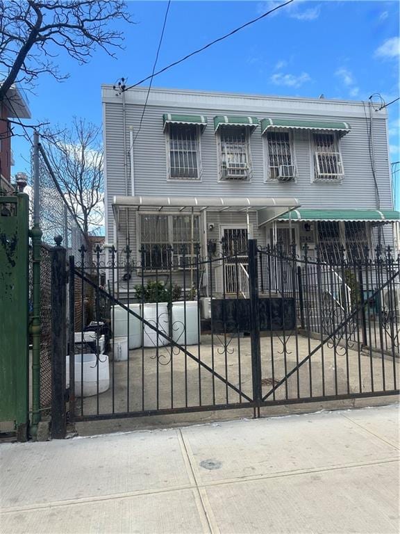 2878 W 16th St, Brooklyn, NY 11224 - view of front of home featuring a fenced front yard and a gate