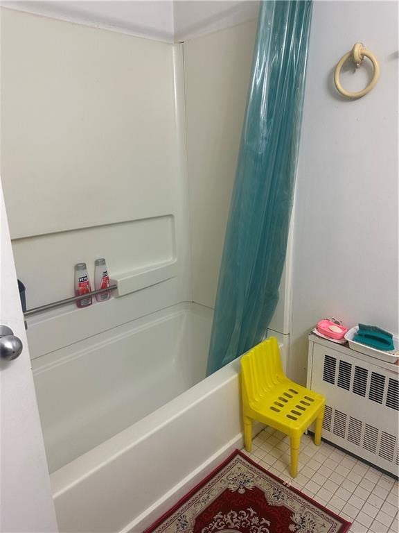2878 W 16th St, Brooklyn, NY 11224 - bathroom with radiator, shower / bath combination with curtain, and tile patterned floors