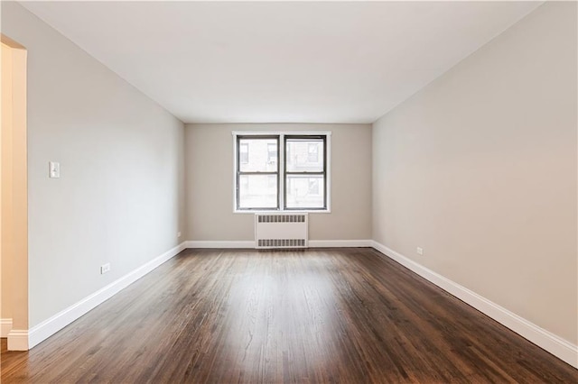 1119 Ocean Pkwy Unit 2A, Brooklyn, NY 11230 - unfurnished room with radiator, dark wood-style floors, and baseboards
