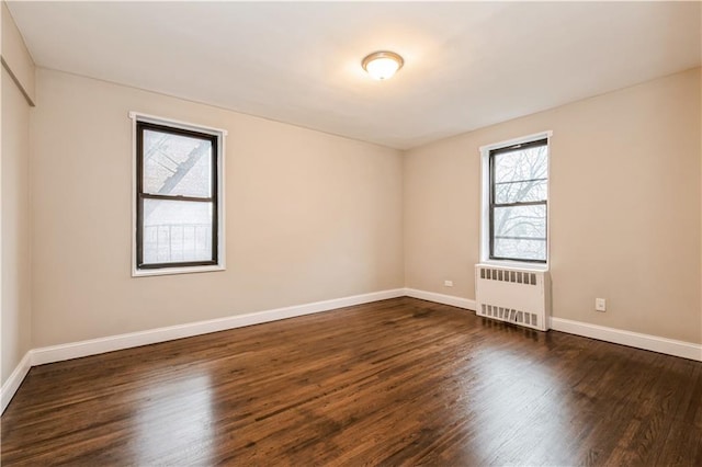 1119 Ocean Pkwy Unit 2A, Brooklyn, NY 11230 - unfurnished room with radiator, wood finished floors, and baseboards