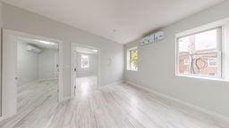 7902 16th Ave, Brooklyn, NY 11214 - empty room featuring baseboards and wood finished floors