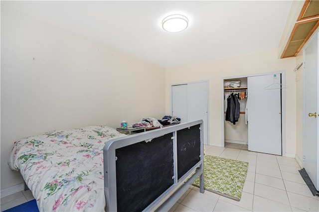 4715 Bedford Ave, Brooklyn, NY 11235 - bedroom with light tile patterned floors and baseboards
