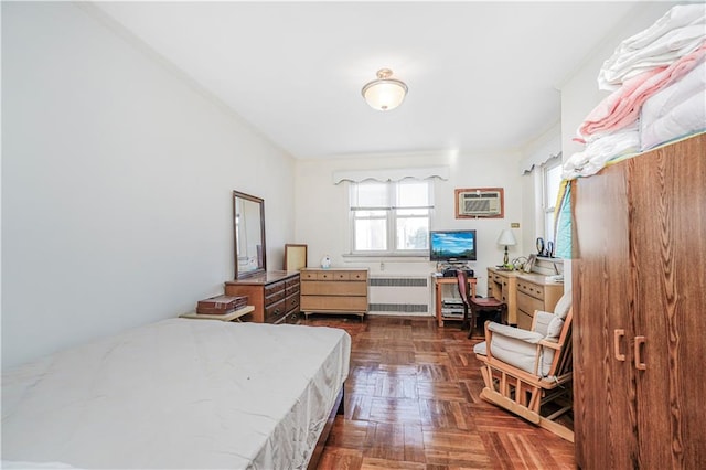 4715 Bedford Ave, Brooklyn, NY 11235 - bedroom with radiator heating unit, ornamental molding, an AC wall unit, and a desk