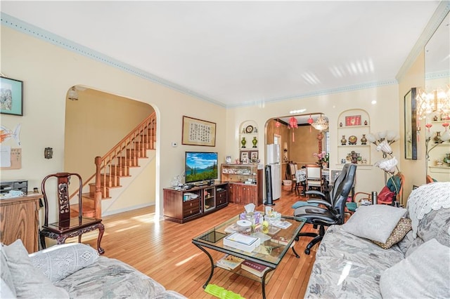 4715 Bedford Ave, Brooklyn, NY 11235 - living room with arched walkways, crown molding, wood-type flooring, and stairs
