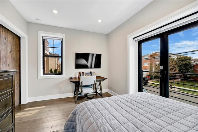 bedroom featuring wood-type flooring, recessed lighting, and baseboards
